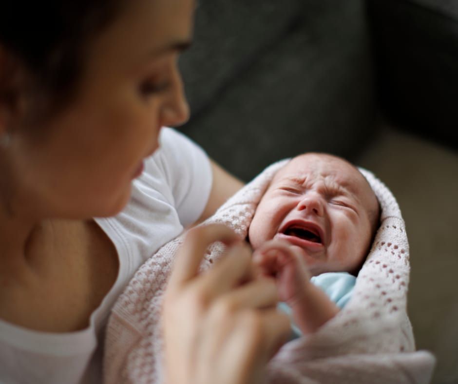 Newborn Care Specialist With Baby